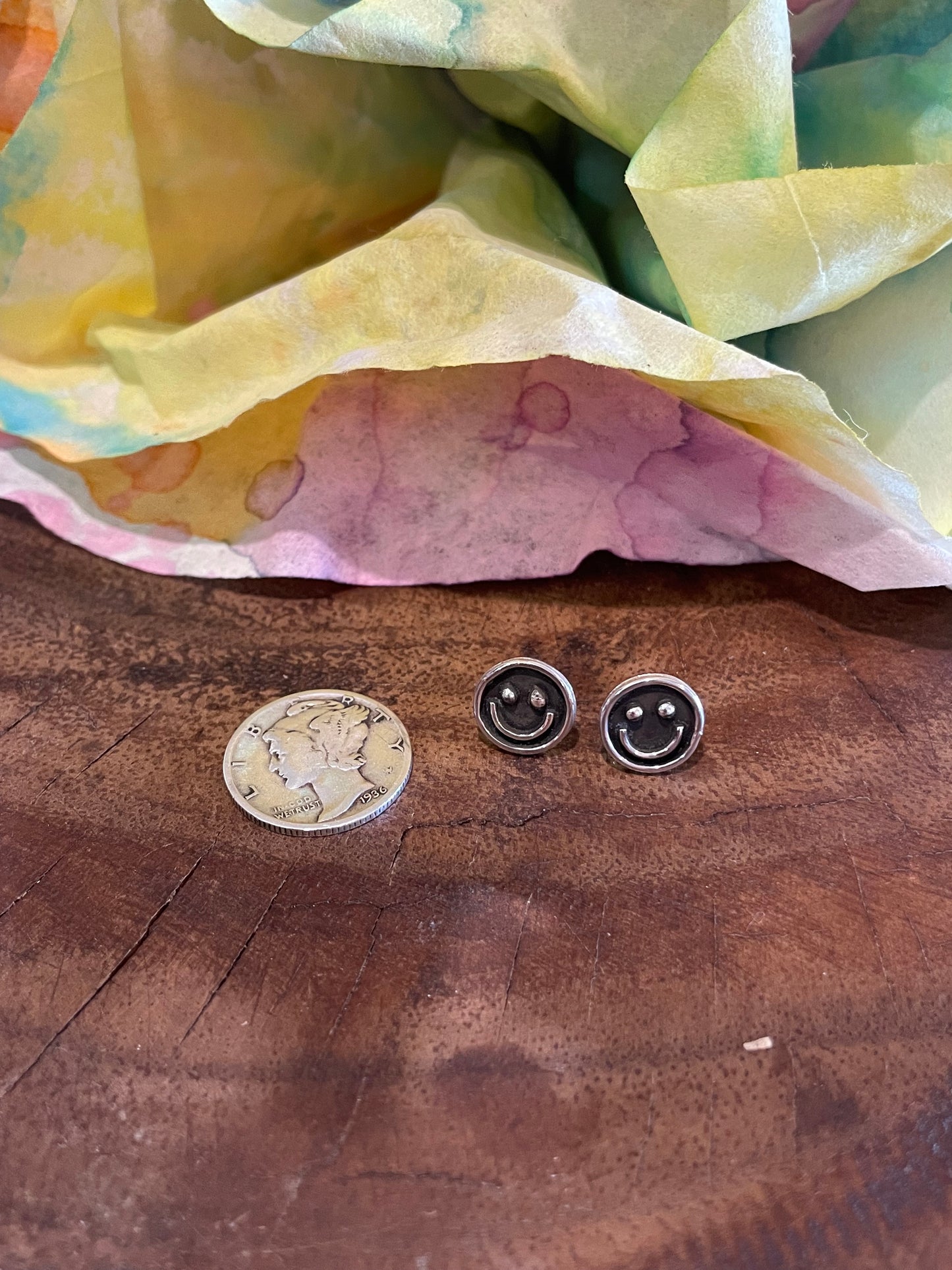 Silver smiley face stud earrings
