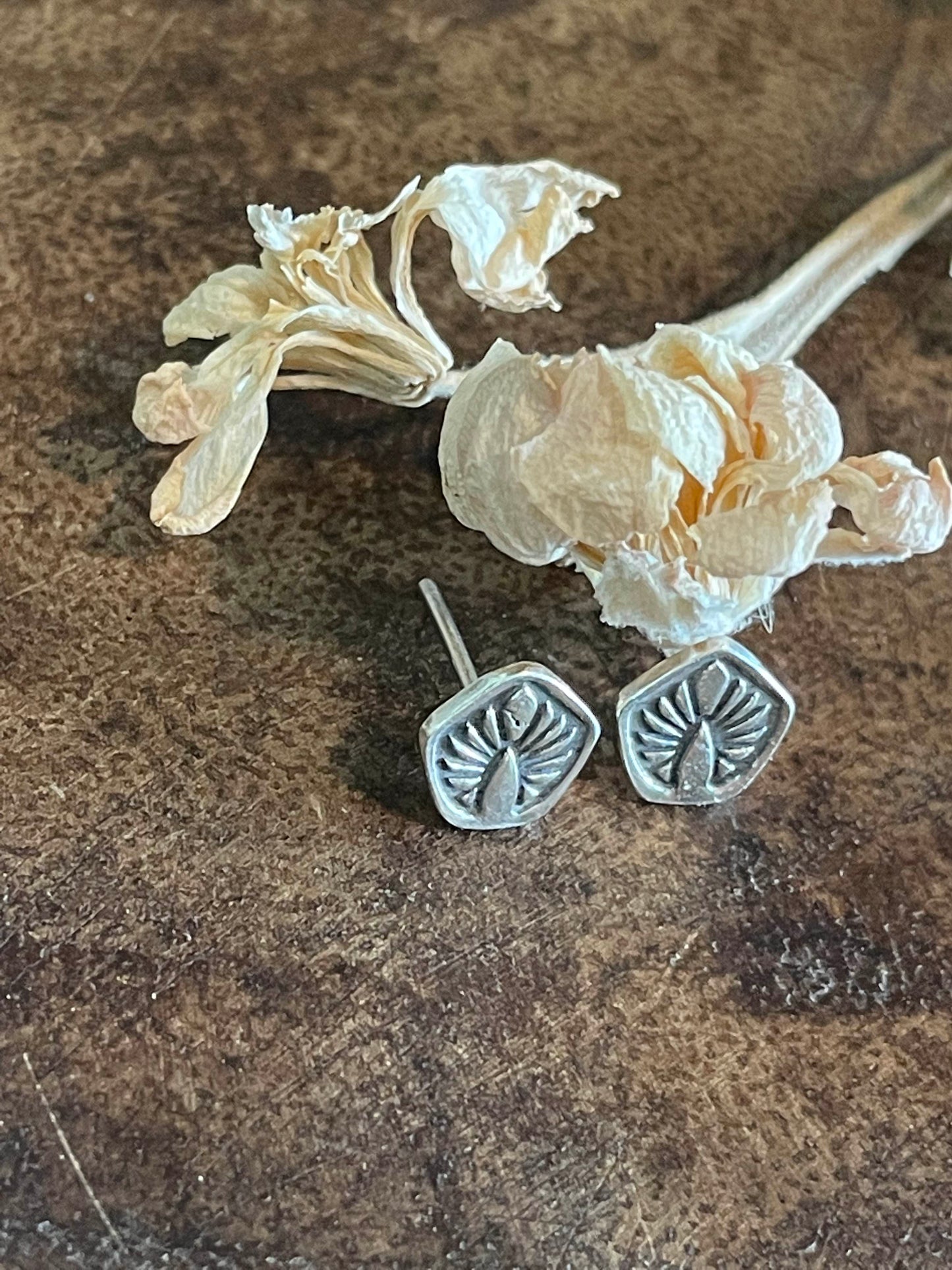 Simple silver "leaf" studs