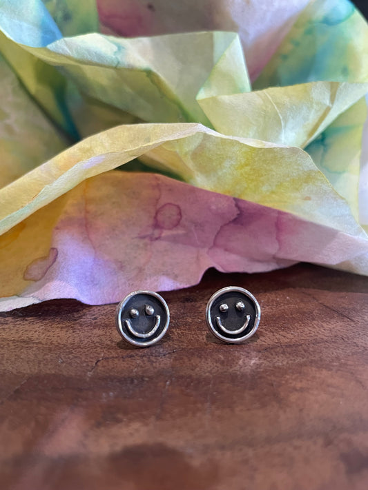 Silver smiley face stud earrings