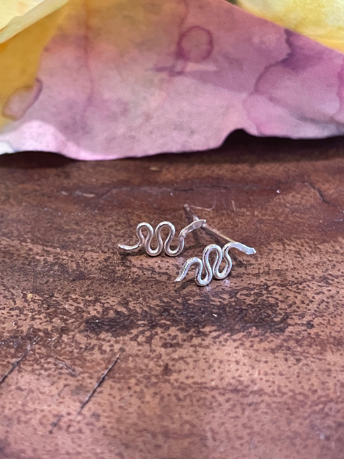 Silver snake studs