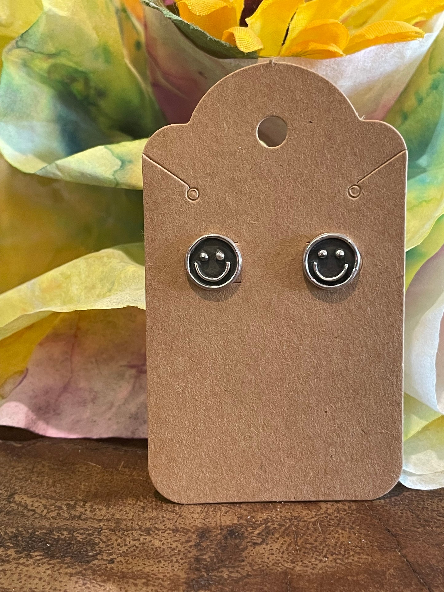 Silver smiley face stud earrings